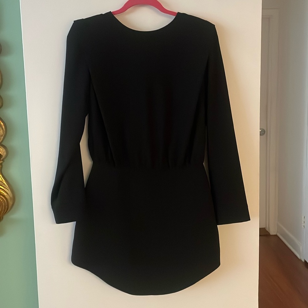 Little black statement mini dress with subtle shoulder, zip back, waist